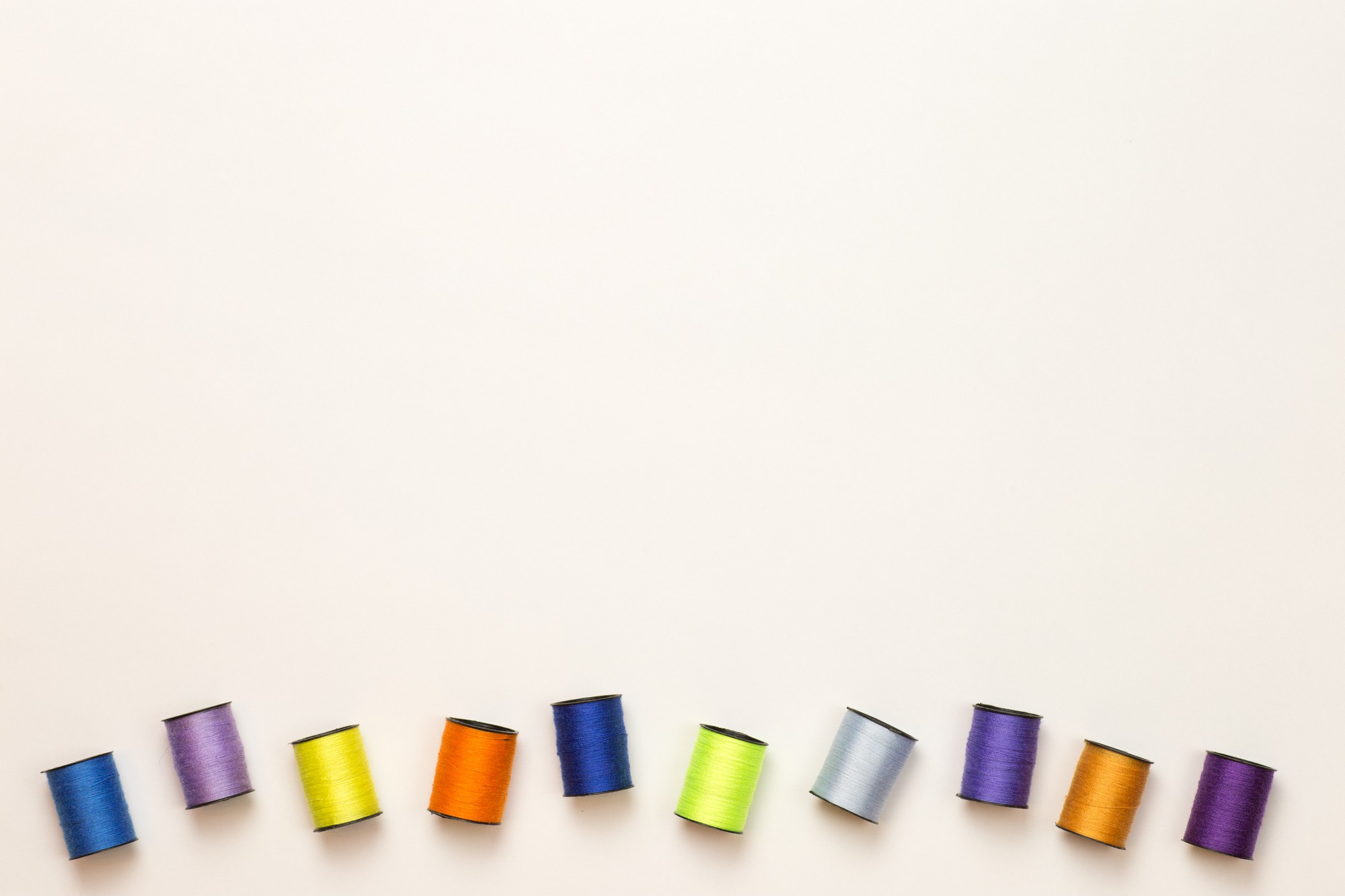 Series of color thread spools and pattern